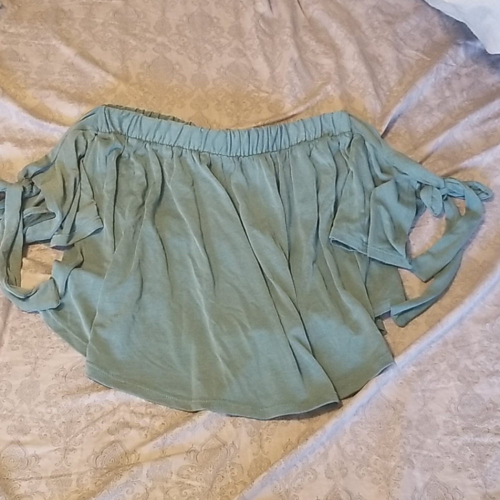 GB over shoulders green shirt